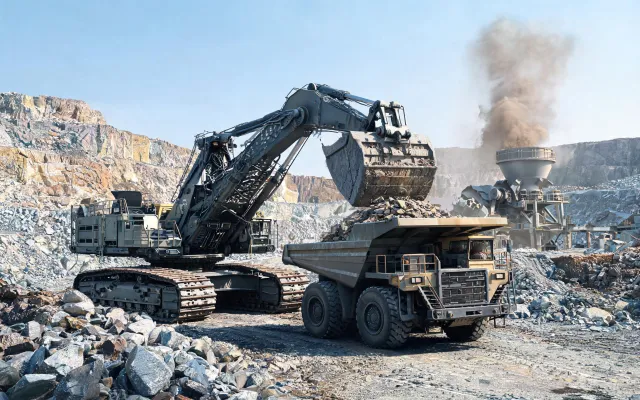 Open pit quarry excavator loading with reinforced undercarriage